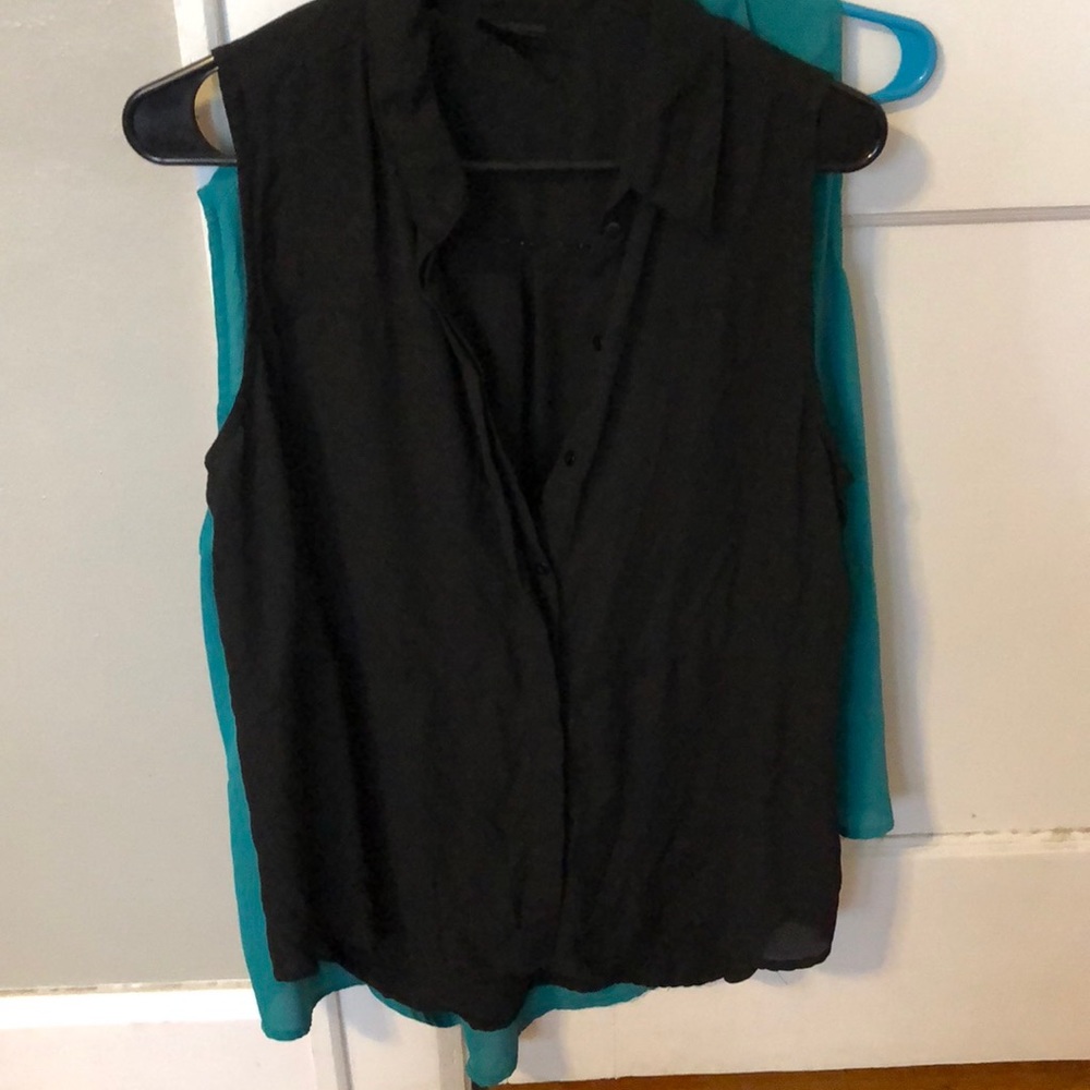 TWO sleeveless button up blouses